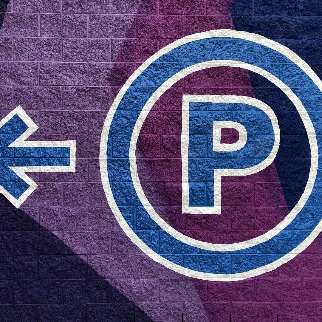 Textured Brick Wall Parking Directional Sign — Commercial Signage installed by Stingray Signs LLC