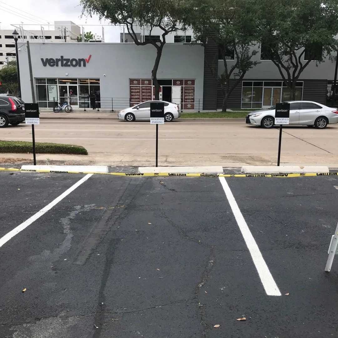 Verizon Wireless retail storefront steel post-mounted customer parking and directional lot sign