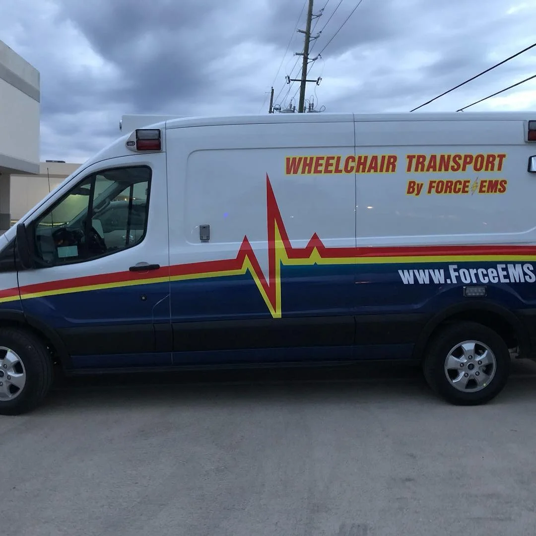 Force EMS medical wheelchair transport van reflective fleet graphics and safety lettering in Texas