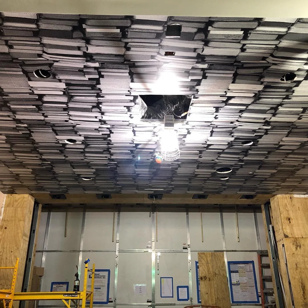 Book-Spine Ceiling Wrap In-Progress Install — Wall Murals & Interiors installed by Stingray Signs LLC