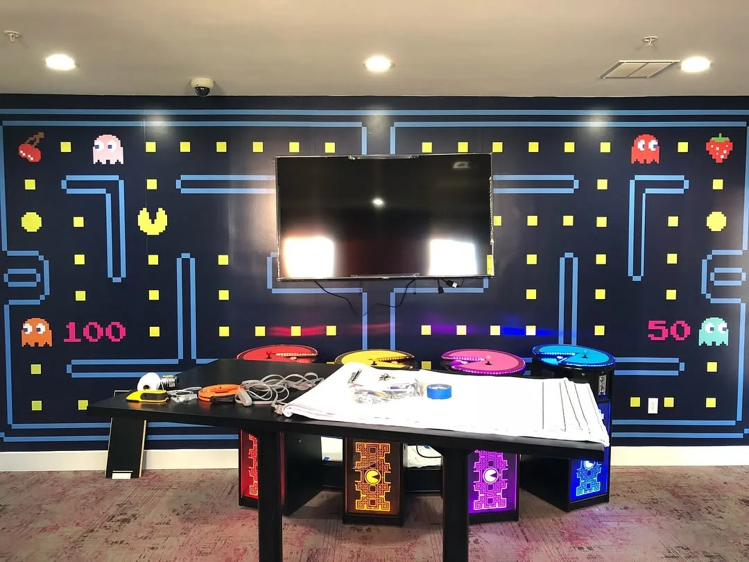 Custom full-wall Pac-Man arcade maze vinyl wall mural precision-cut around displays by Stingray Signs LLC
