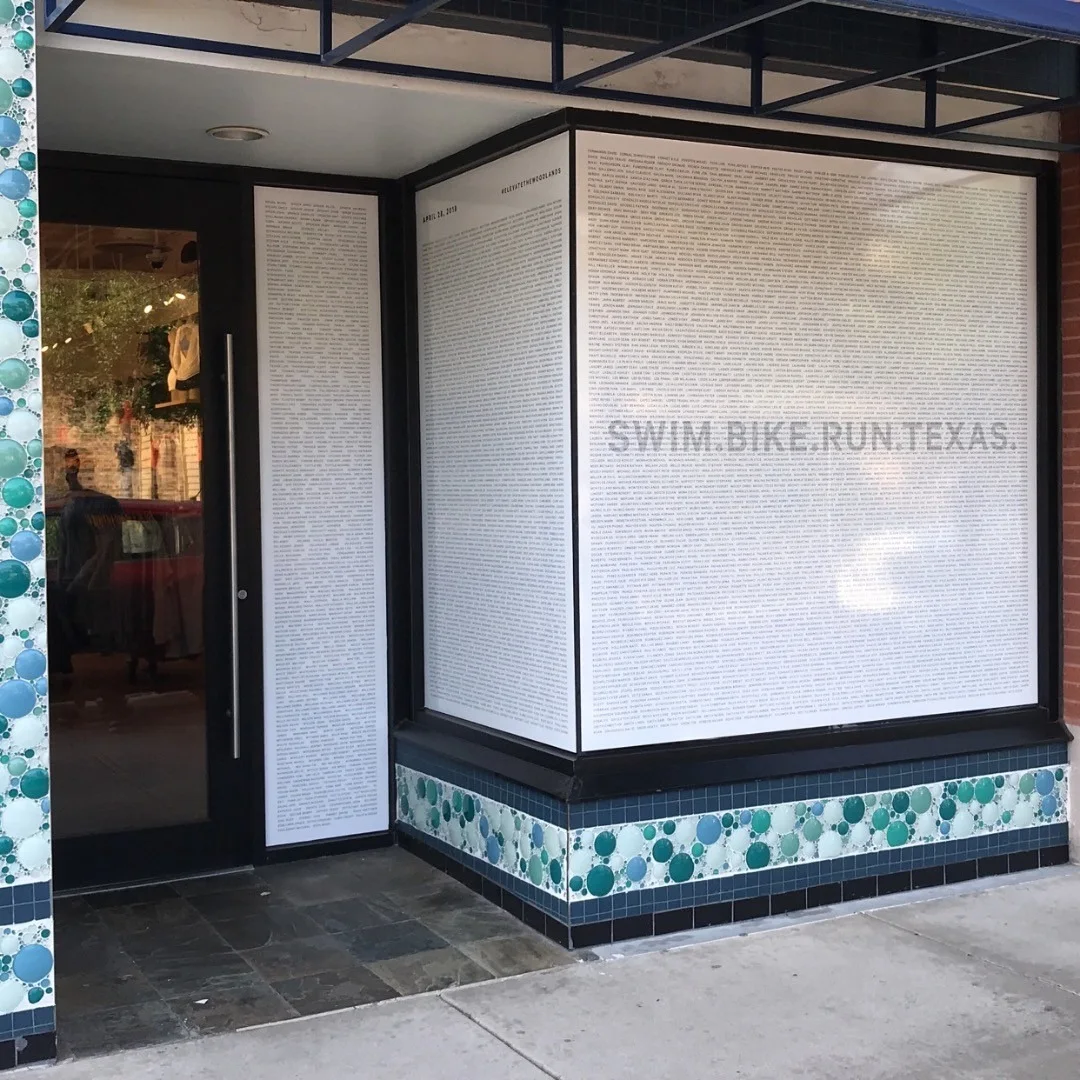 Swim.Bike.Run.Texas Window Perf — Storefront Window Graphics installed by Stingray Signs LLC